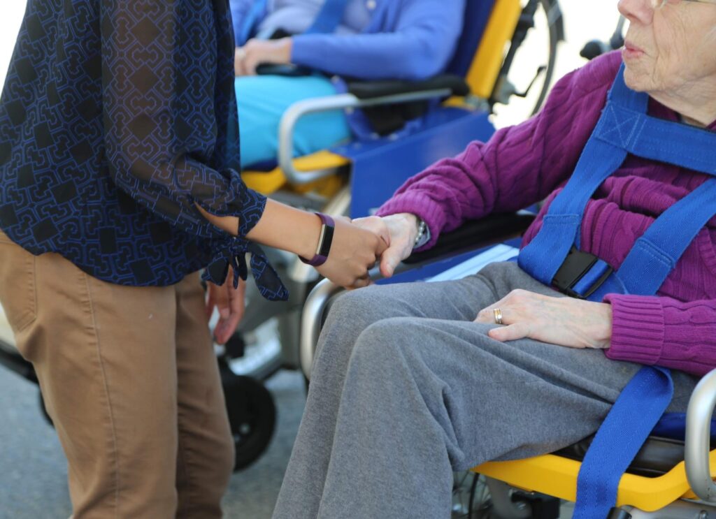student meeting w elderly person, community service