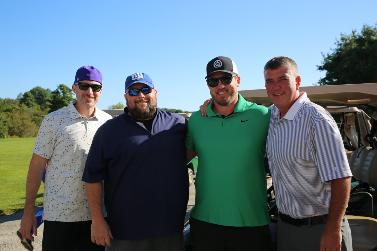 group of men at golf event outside